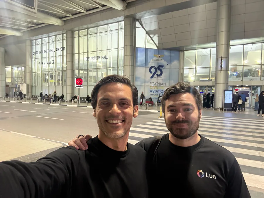 Two team members at Cairo International Airport