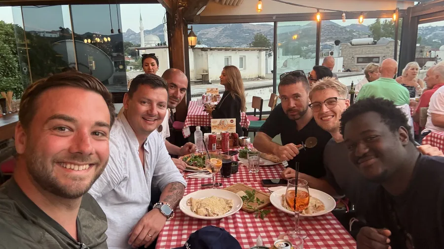 The team at a rooftop dinner during an offsite